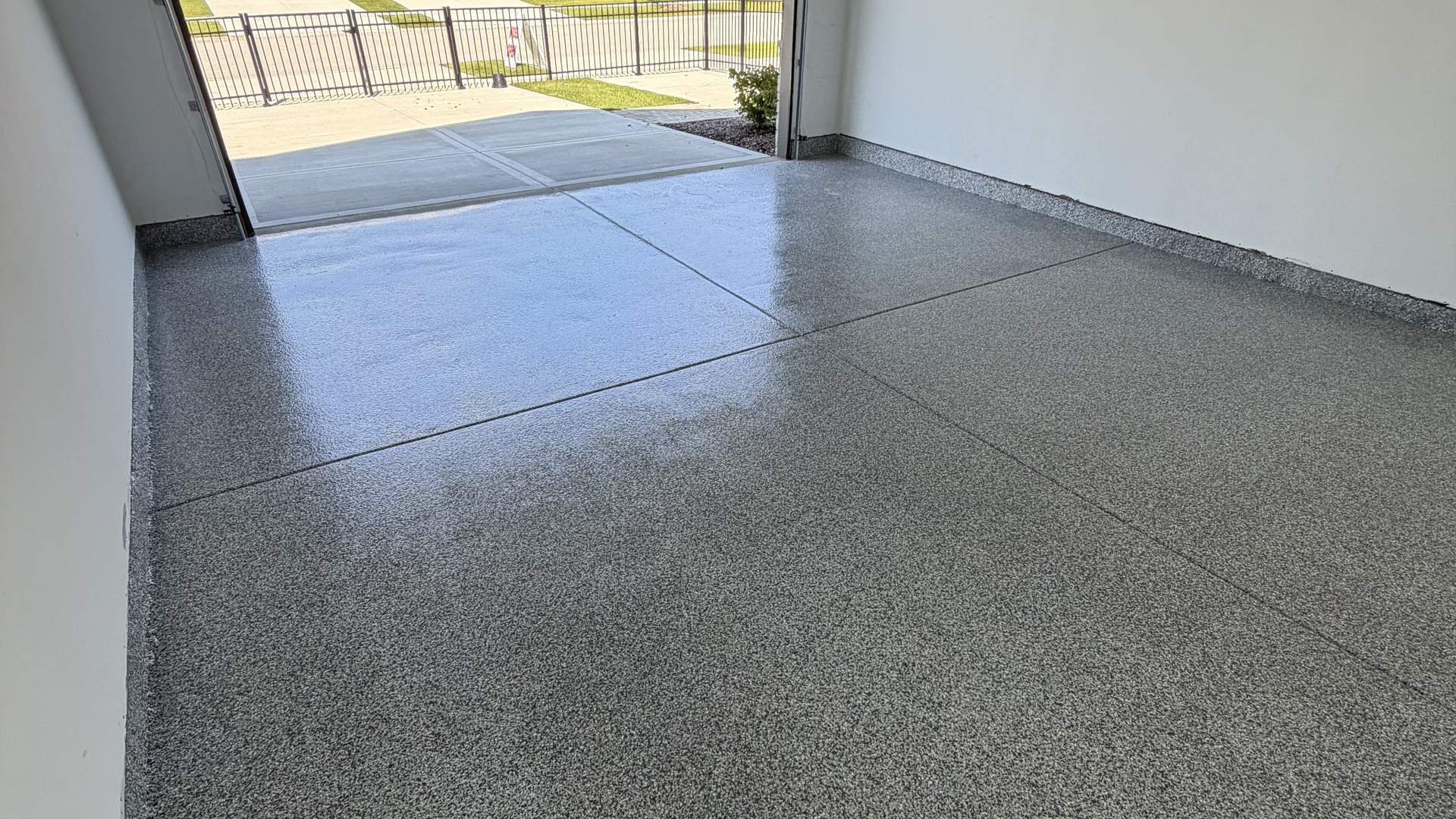 Gray flake epoxy garage floor coating in a residential two-car garage